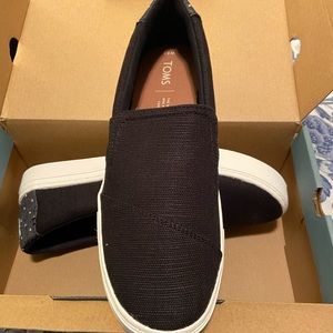 Black slip-on Toms
